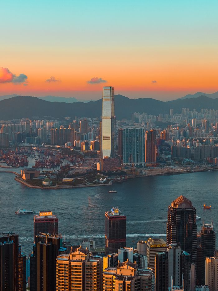 Crafting Captivating Headlines: Your awesome post title goes here Breathtaking Hong Kong skyline showcasing tall skyscrapers and harbor at sunset.
